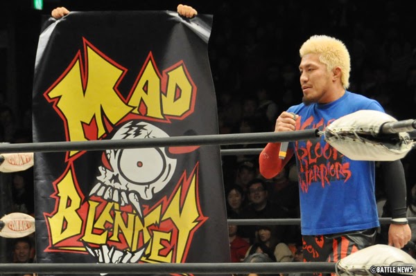 Tozawa alongside the Mad Blankey logo