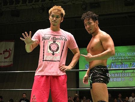 Harada and Kotoge in the ring after reuniting in 2015