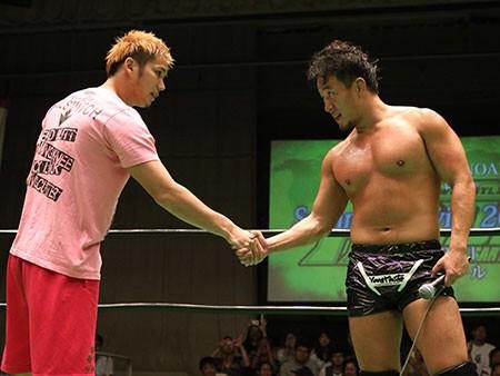 Harada and Kotoge shaking hands after reuniting in 2015