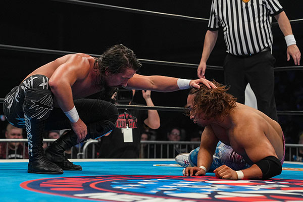 Jay White during his match with Shota Umino. White is patting Umino's head in a condescending manner. 