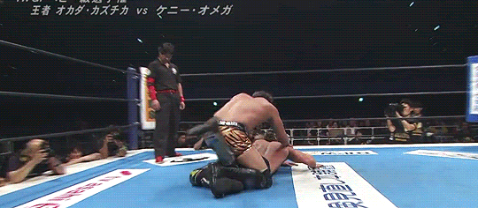 Gif from the match of Okada applying a facelock on Kenny