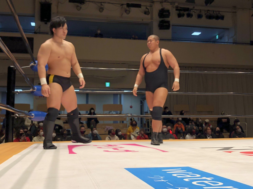 Okada and Inamura in the corner of the ring, teaming together at Diamond 3, the Kongo produce show.