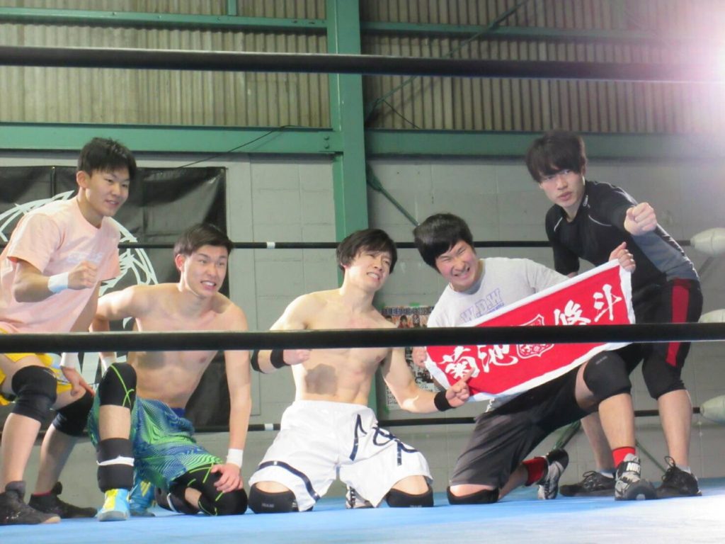 Kansai's young wrestlers pose in the ring. 